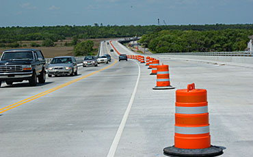 image of orange cones on a bridge